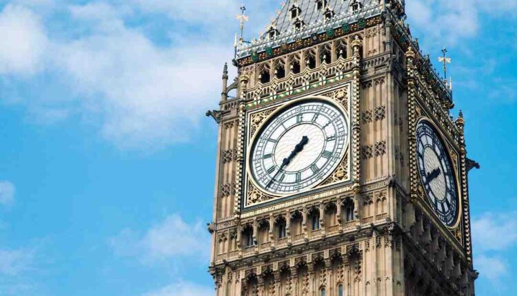 An ambulance has overturned after colliding with a bus in Westminster