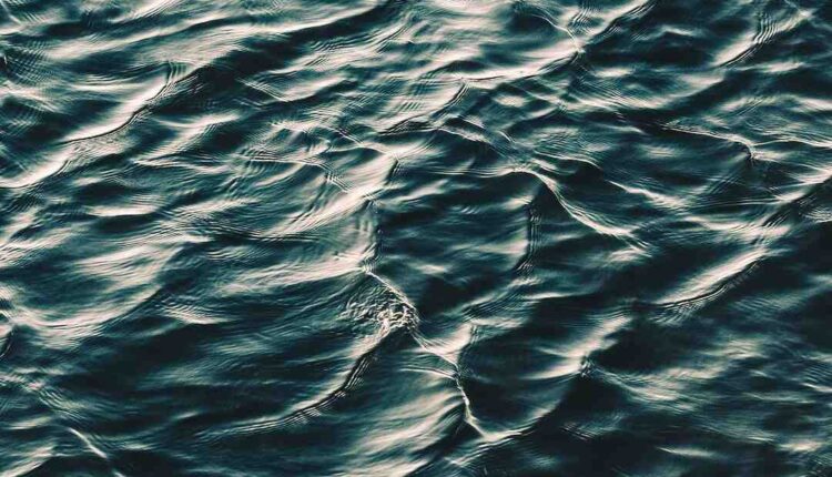 A jet of water spray cars in Woolwich