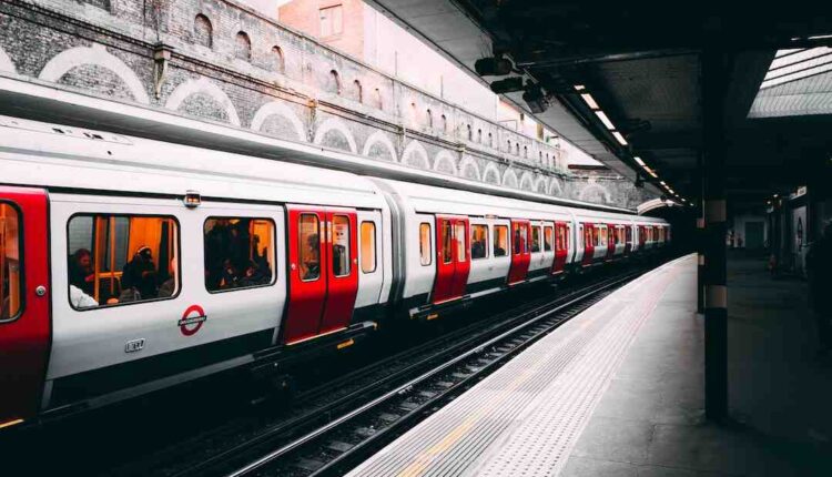 A man pushes a Just Stop Oil activist to the ground during a slow march protest in London